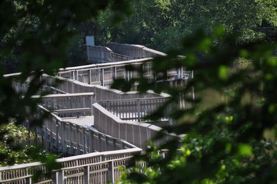 Built structure by trees and building in city