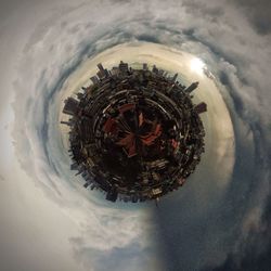 Little planet image of cityscape against cloudy sky during sunset