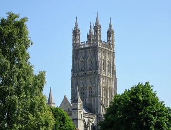 Low angle view of clock tower against sky