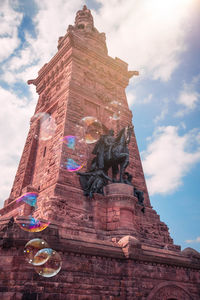 Low angle view of statue against sky