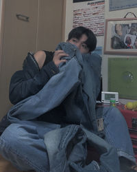Man sitting on chair at home
