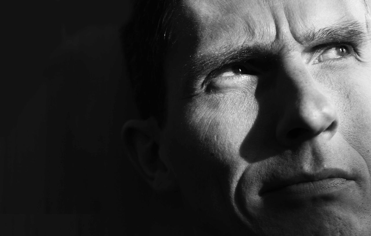 headshot, close-up, human face, looking at camera, portrait, person, indoors, young adult, lifestyles, front view, contemplation, leisure activity, serious, head and shoulders, young men, mid adult