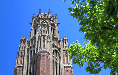 Low angle view of building against blue sky