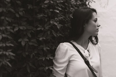 Portrait of young woman looking away