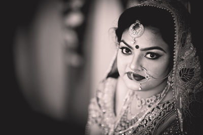 Portrait of young bride in traditional clothing 