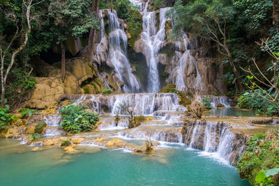 Kuang si waterfalls clear waters in area luang prabang, laos