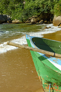 Close-up of boat moored in sea