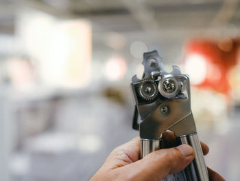 Cropped hand holding camera