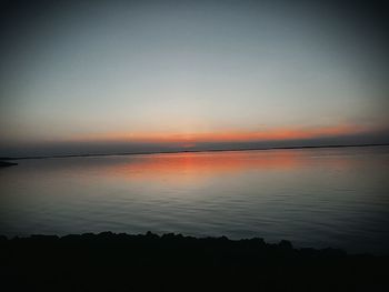 Scenic view of sea against sky at sunset