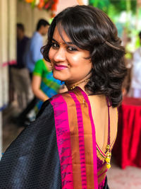 Portrait of smiling young woman in sari