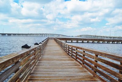 Pier over sea against sky