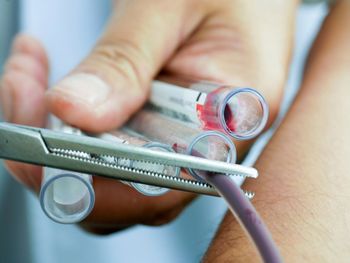 Cropped hand of nurse holding medical equipment