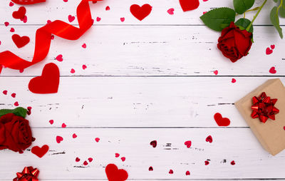 High angle view of red rose on table