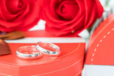 Close-up of red rose on table