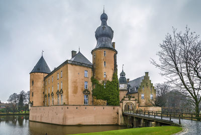 View of buildings against cloudy sky