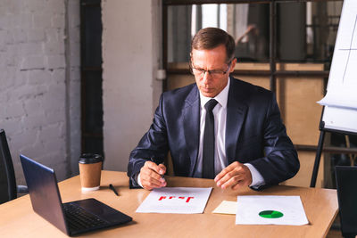 Portrait of businessman working at office