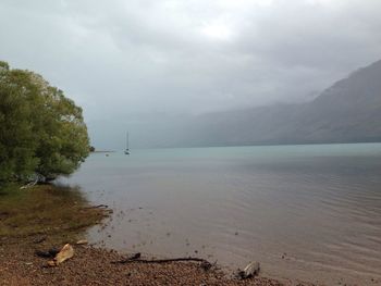 Scenic view of sea against cloudy sky