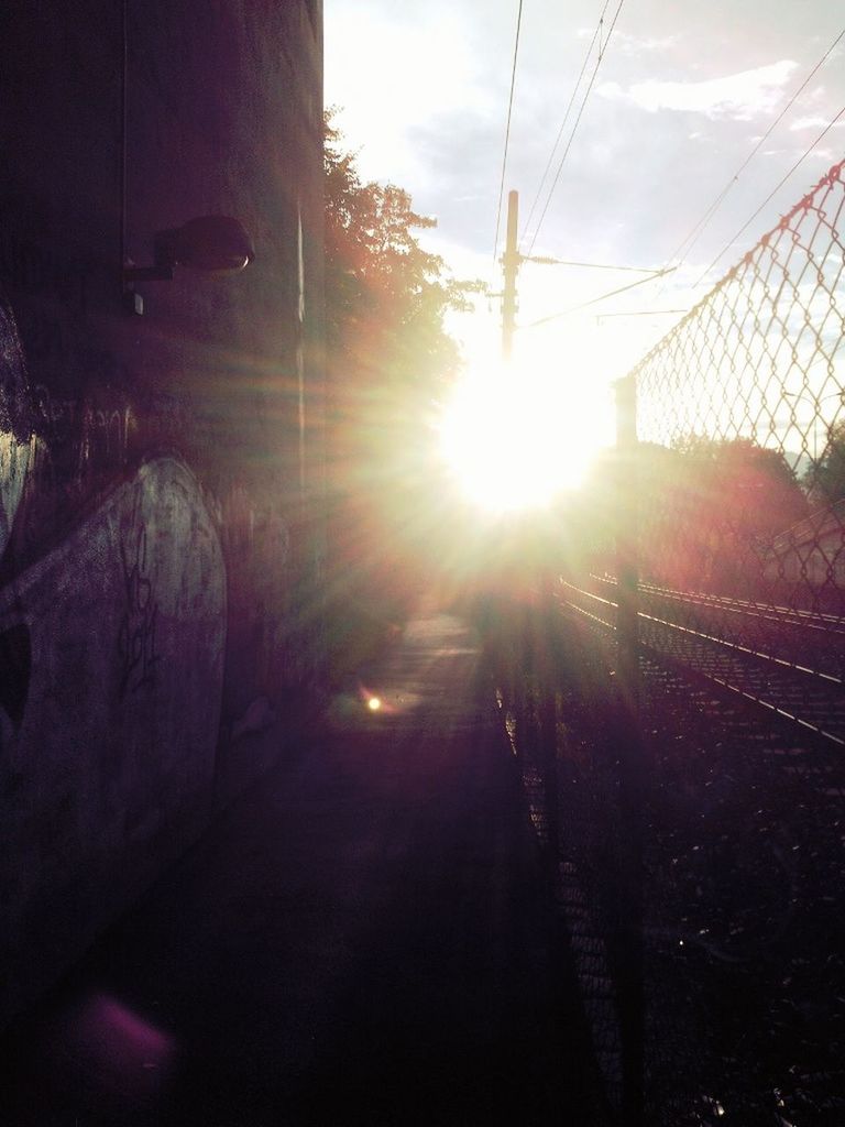 sun, sunbeam, lens flare, sunlight, transportation, sunset, sky, mode of transport, bright, built structure, land vehicle, sunny, car, architecture, the way forward, glass - material, transparent, indoors, travel, day