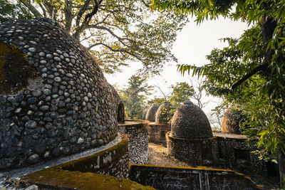 Fountain in temple against trees