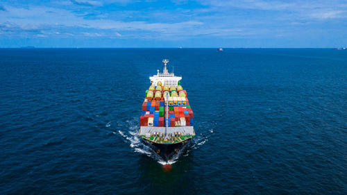 Ship in sea against sky