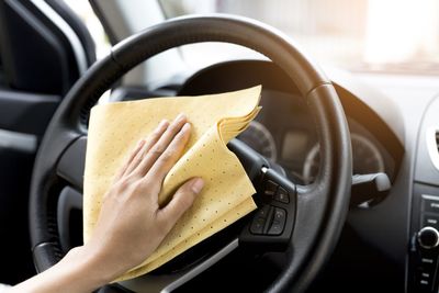 Close-up of woman hand in car