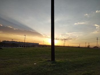 Scenic view of field against sky during sunset