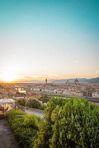 High angle view of city buildings during sunset
