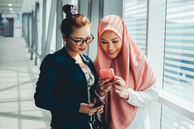 Young woman using mobile phone