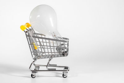 A big light bulb in a shopping cart, a close-up