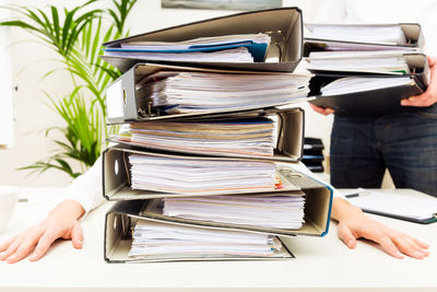 Cropped image of man working on table