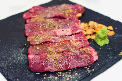 Close-up of meat on barbecue grill