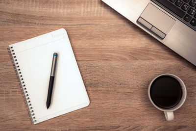 High angle view of coffee cup on table