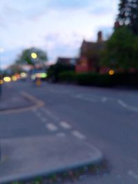 Road by city against sky