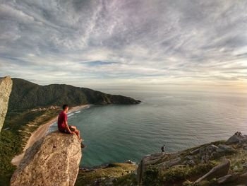 Man looking at sea against sky