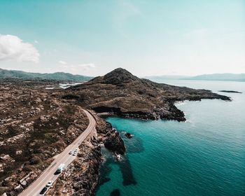 High angle view of road by sea against sky