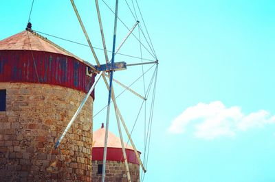 Low angle view of traditional windmill against sky