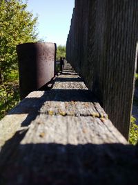 Surface level of footpath against clear sky