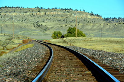 Railroad track leading towards mountain