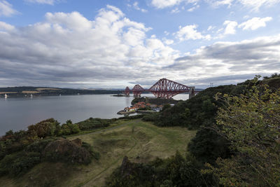 Bridge over bay against sky