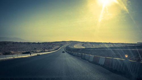 Road amidst landscape against sky