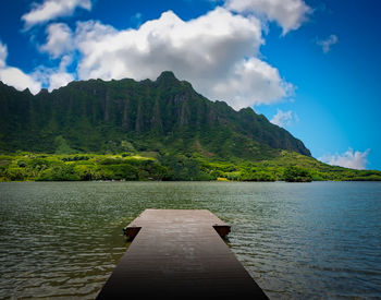 Pier over lake against sky