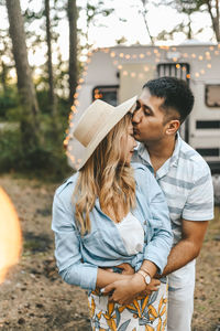 Married asian couple in love travel by camper car on a road trip in nature on their honeymoon