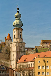 Low angle view of clock tower against sky