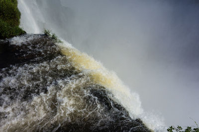 Close-up of waterfall against sky