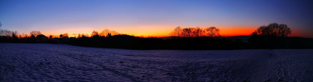 Scenic view of landscape against sky during sunset