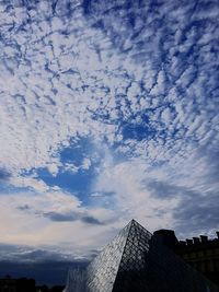 Low angle view of building against blue sky