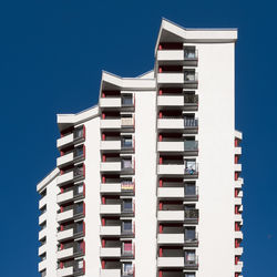 Low angle view of building against blue sky