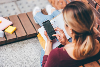 Young woman using mobile phone