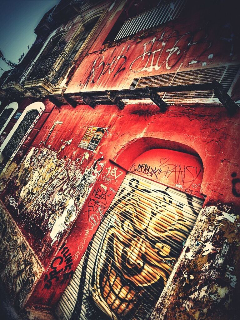 building exterior, architecture, built structure, low angle view, city, part of, close-up, outdoors, no people, old, day, text, auto post production filter, metal, sky, building, history, cropped, sunlight, art and craft