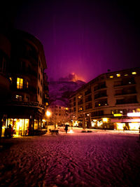 Buildings in city at night